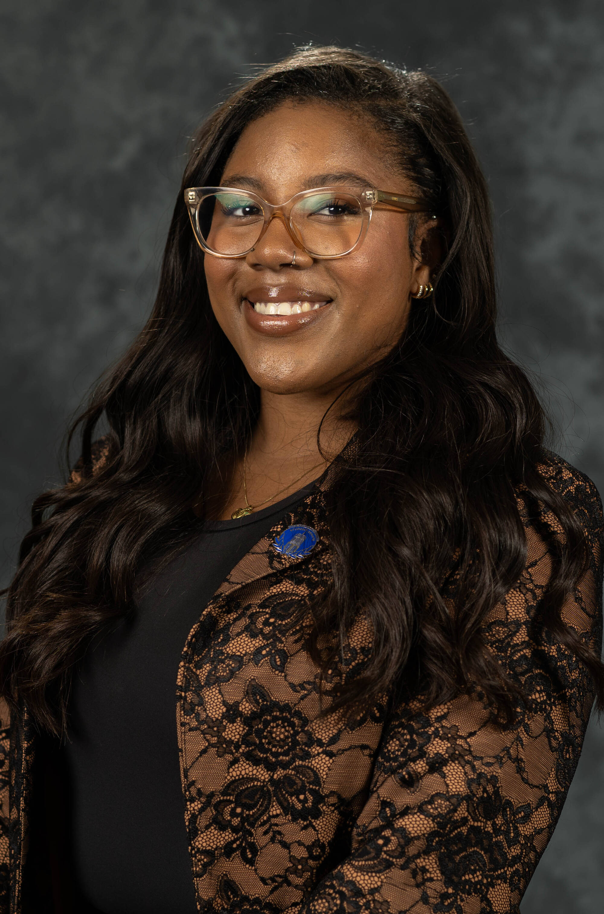 Genna Wright in a brown suit.